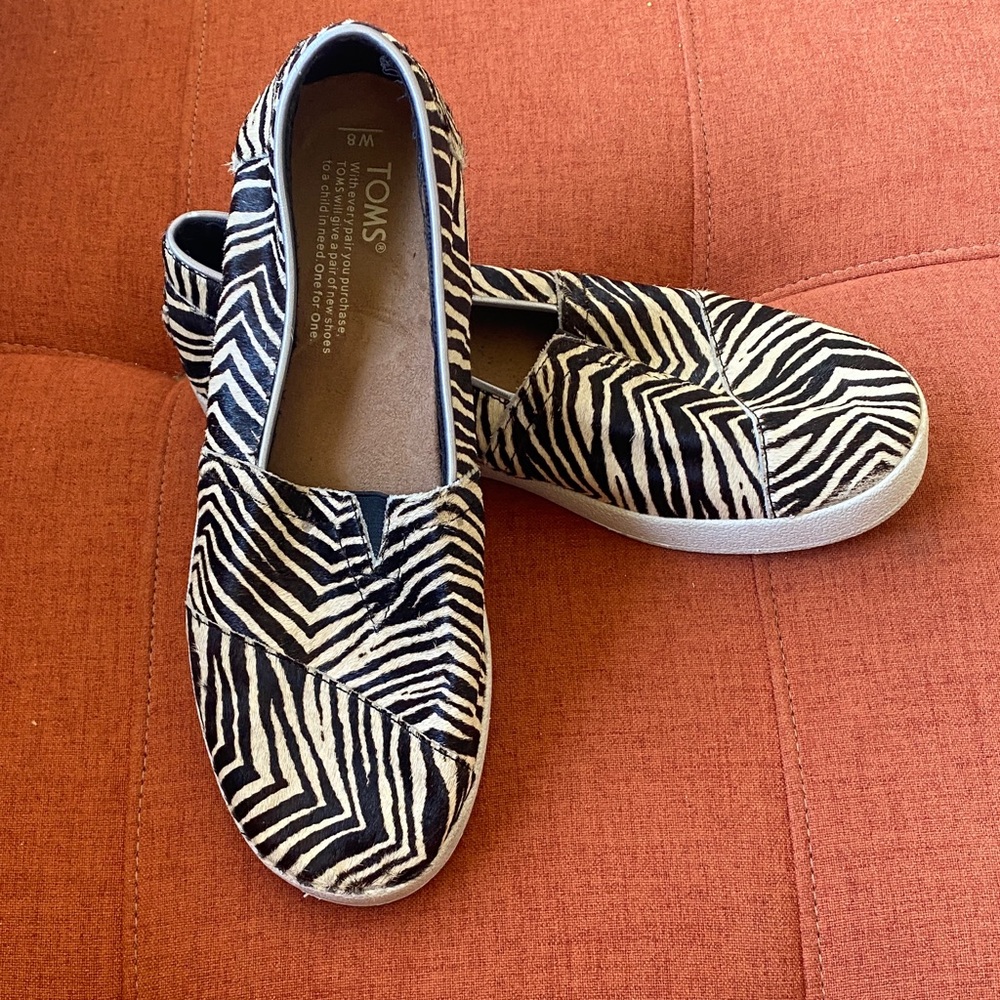 TOMS Black and White Zebra Pattern Slip-Ons